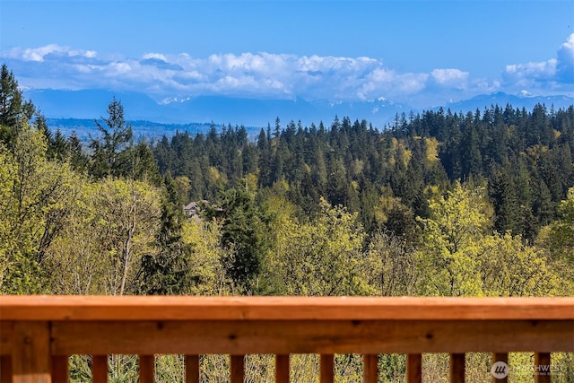 mountain view featuring a view of trees