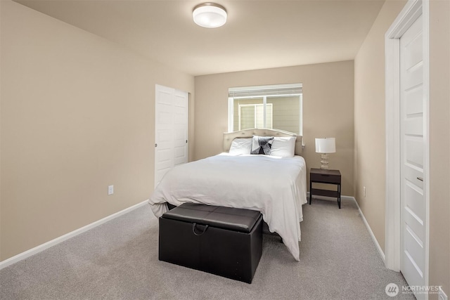 bedroom featuring baseboards and carpet flooring