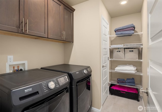 washroom with recessed lighting, tile patterned flooring, washing machine and dryer, baseboards, and cabinet space