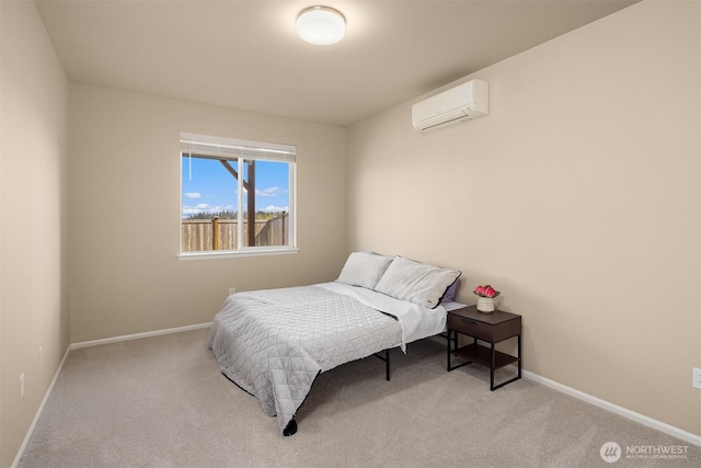 bedroom with baseboards, carpet floors, and a wall mounted air conditioner