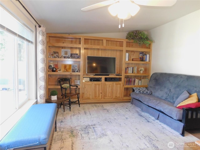 11325 126th St E Unit 229, Puyallup, WA 98374 - living room with light wood finished floors, ceiling fan, vaulted ceiling, and a healthy amount of sunlight