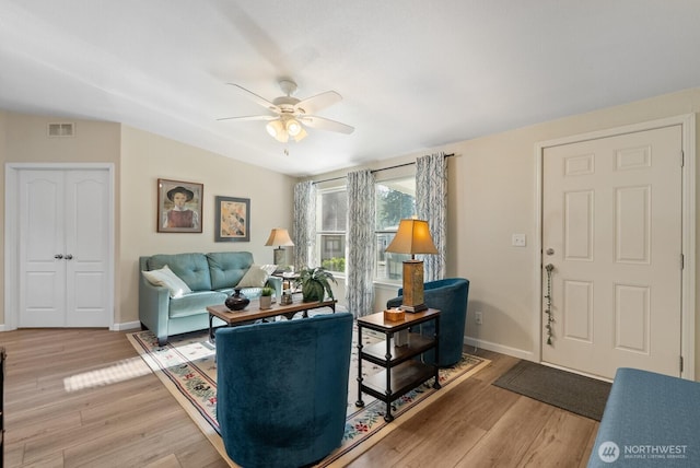 11325 126th St E Unit 229, Puyallup, WA 98374 - living room with baseboards, a ceiling fan, visible vents, and light wood-style floors