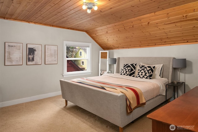 bedroom featuring baseboards, vaulted ceiling, wood ceiling, and carpet