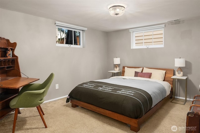 bedroom featuring carpet floors and baseboards