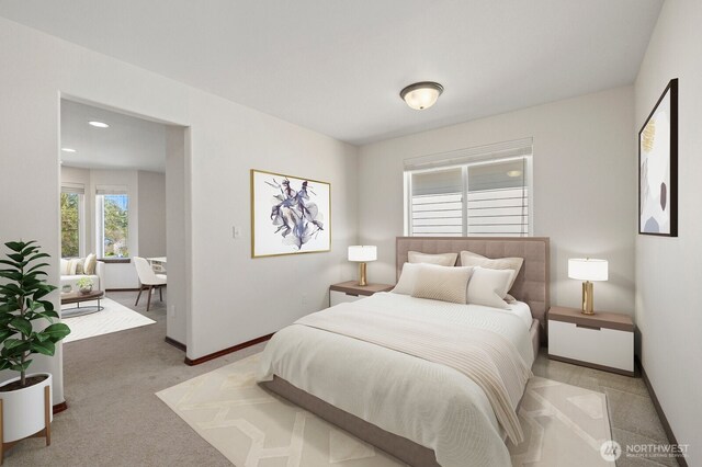 bedroom featuring baseboards and recessed lighting