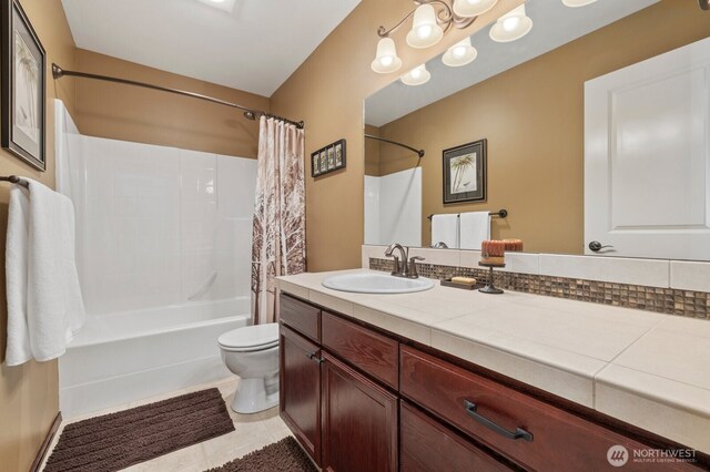 full bathroom with vanity, tile patterned floors, shower / bath combination with curtain, and toilet