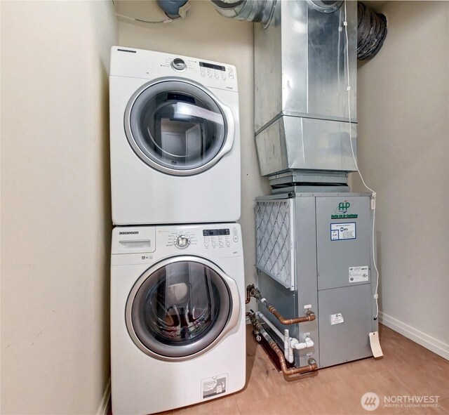 500 106th Ave NE Unit 3109, Bellevue, WA 98004 - laundry area with stacked washer / drying machine, baseboards, and laundry area