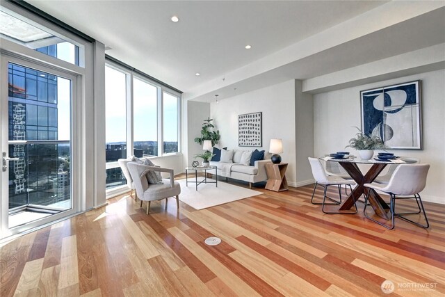 500 106th Ave NE Unit 3109, Bellevue, WA 98004 - interior space with a wall of windows, light wood finished floors, baseboards, and recessed lighting