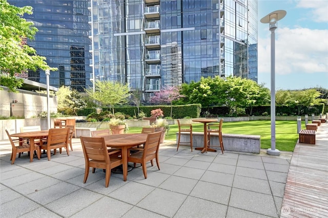 500 106th Ave NE Unit 3109, Bellevue, WA 98004 - view of property's community with a patio area, a lawn, and outdoor dining space