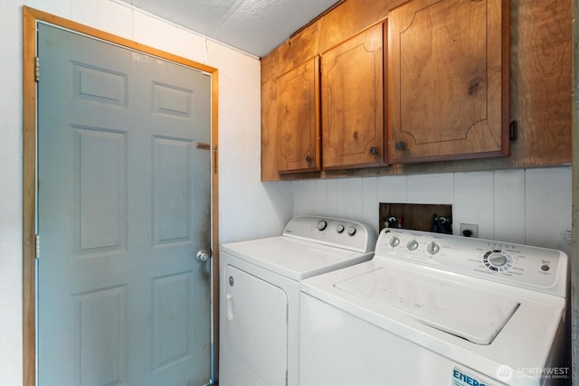 157 Camelot Dr, Castle Rock, WA 98611 - clothes washing area with washing machine and dryer and cabinet space