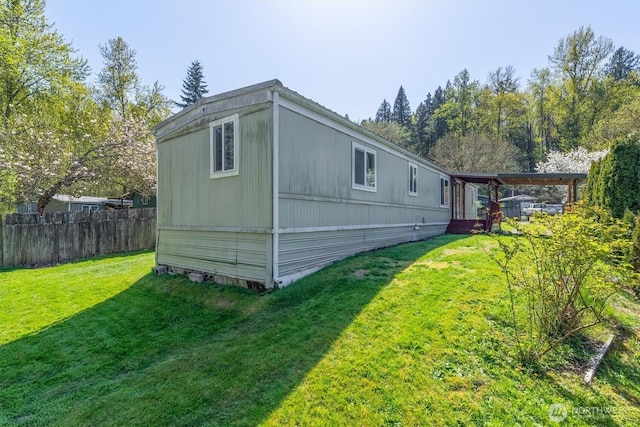 157 Camelot Dr, Castle Rock, WA 98611 - view of side of home with a yard and fence