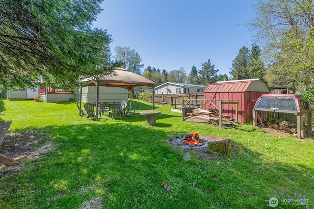 157 Camelot Dr, Castle Rock, WA 98611 - view of yard with a fire pit, an outdoor structure, and fence