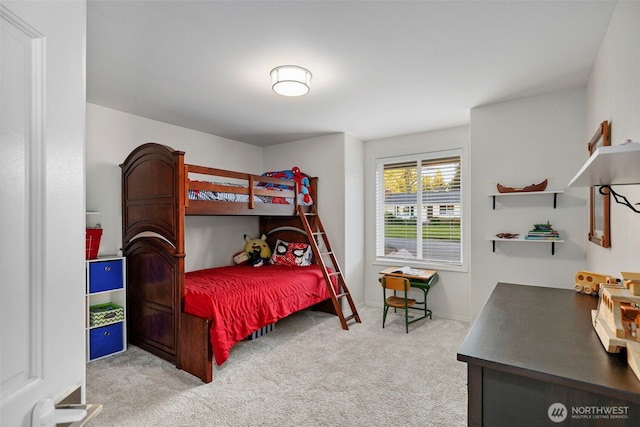 carpeted bedroom featuring baseboards