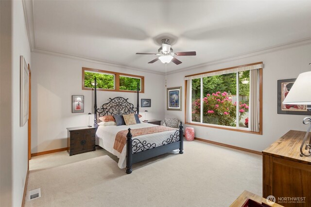 bedroom featuring crown molding, carpet floors, baseboards, and visible vents