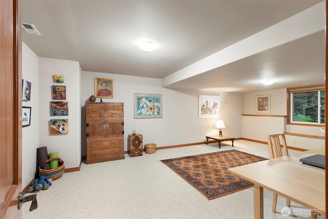 carpeted office space with baseboards and visible vents
