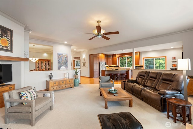 living area with crown molding, light carpet, ceiling fan with notable chandelier, and recessed lighting