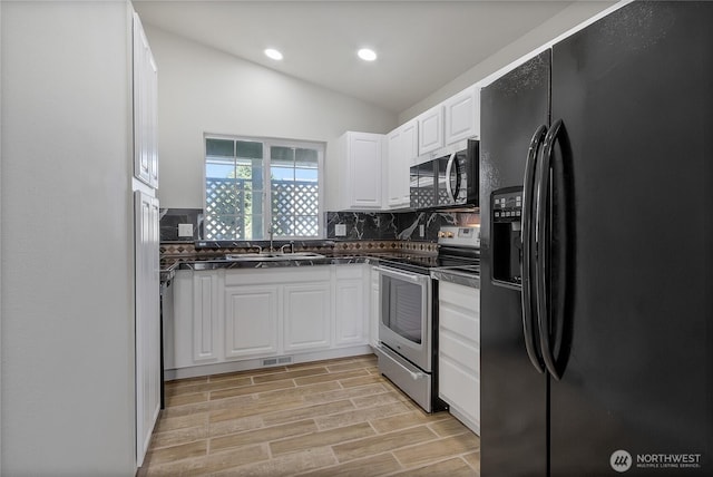 2322 157th Street Ct E, Tacoma, WA 98445 - kitchen featuring dark countertops, appliances with stainless steel finishes, tasteful backsplash, and a sink