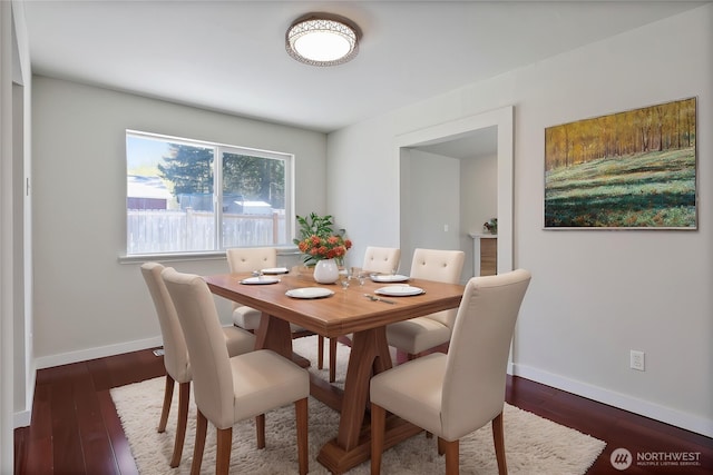 2322 157th Street Ct E, Tacoma, WA 98445 - dining room featuring baseboards and dark wood-style flooring