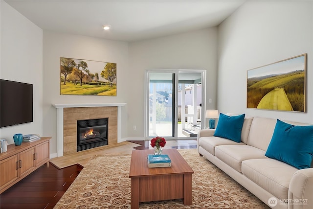 2322 157th Street Ct E, Tacoma, WA 98445 - living area with a fireplace, wood finished floors, and baseboards