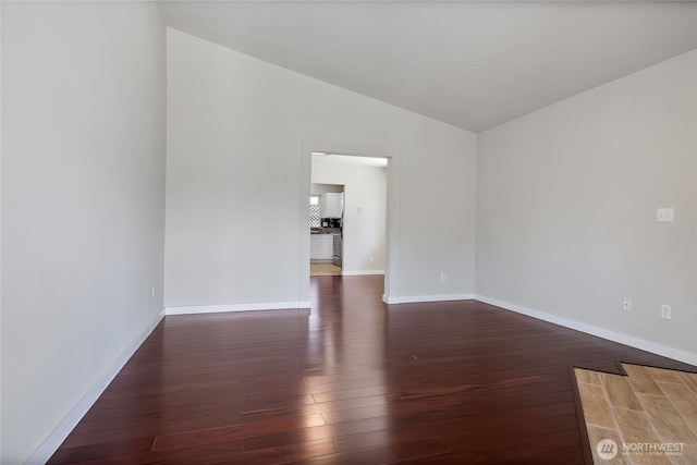 2322 157th Street Ct E, Tacoma, WA 98445 - unfurnished room featuring hardwood / wood-style flooring, vaulted ceiling, and baseboards