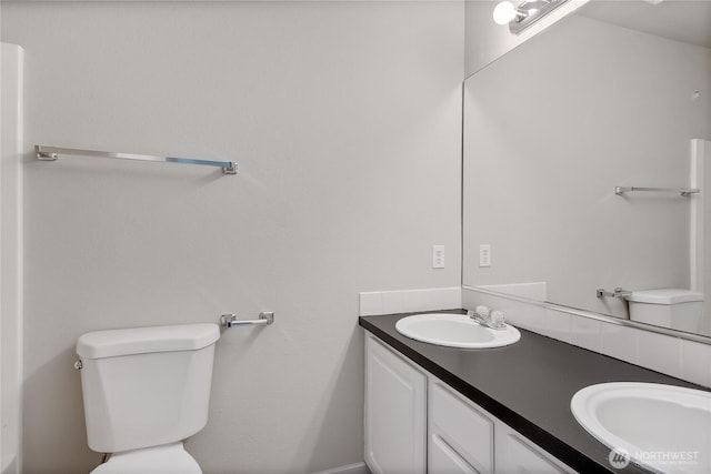 2322 157th Street Ct E, Tacoma, WA 98445 - bathroom featuring double vanity, toilet, and a sink