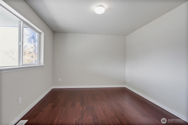 2322 157th Street Ct E, Tacoma, WA 98445 - empty room with wood finished floors, a healthy amount of sunlight, and baseboards