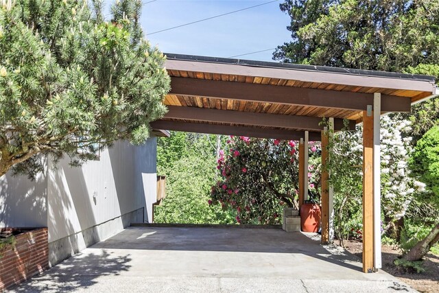 view of vehicle parking with a carport