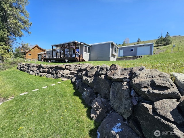 view of yard with a wooden deck