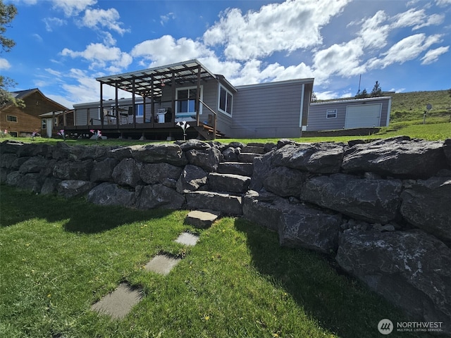exterior space with a lawn and a wooden deck