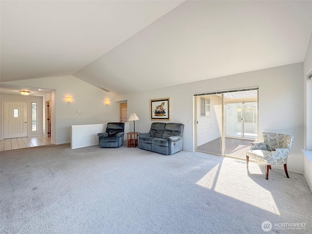 462 E Runnion, Sequim, WA 98382 - living area featuring lofted ceiling, visible vents, plenty of natural light, and carpet flooring