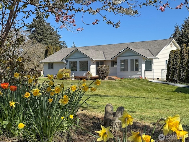 462 E Runnion, Sequim, WA 98382 - view of front of house with a front yard and roof with shingles