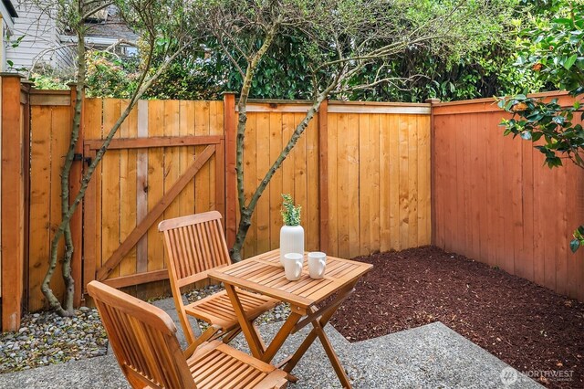 view of patio / terrace with fence and a gate