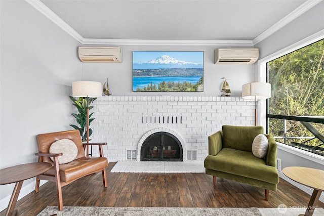 living area with a wall mounted air conditioner, ornamental molding, and wood finished floors