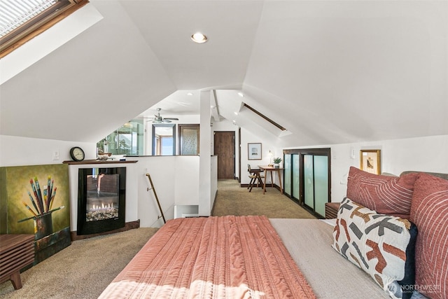 carpeted bedroom with recessed lighting and lofted ceiling with skylight
