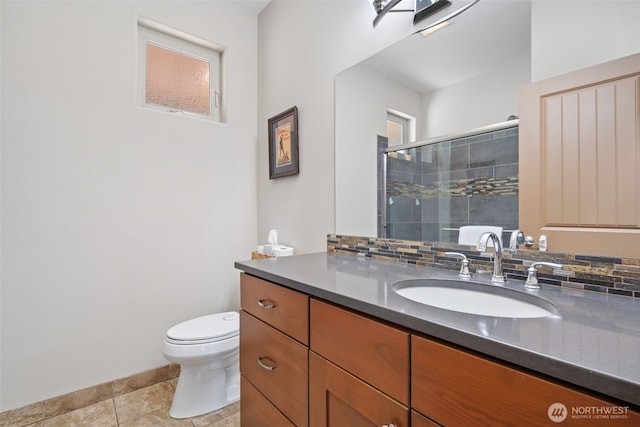 27406 NE 65th St, Camas, WA 98607 - full bath featuring vanity, a tile shower, toilet, baseboards, and tile patterned flooring