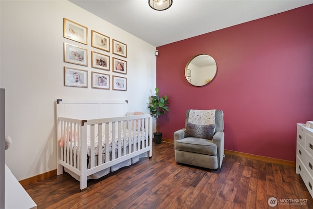 27406 NE 65th St, Camas, WA 98607 - bedroom with wood finished floors, a nursery area, and baseboards