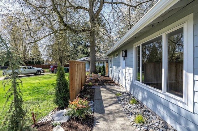 303 Alder Ln N, Pacific, WA 98047 - view of property exterior featuring fence and a lawn