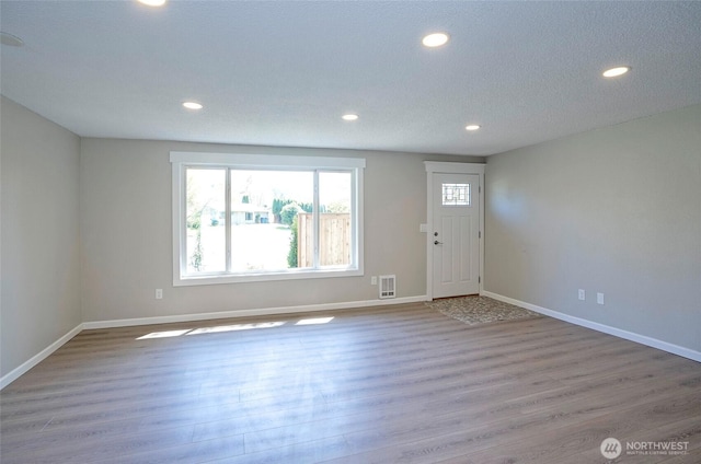 303 Alder Ln N, Pacific, WA 98047 - interior space with wood finished floors, baseboards, and recessed lighting
