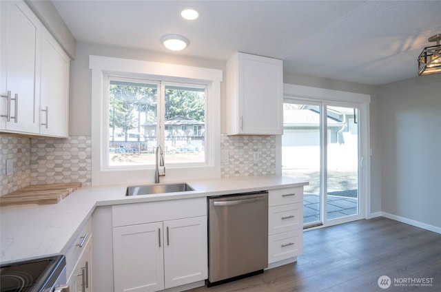 303 Alder Ln N, Pacific, WA 98047 - kitchen with range, white cabinetry, stainless steel dishwasher, a sink, and wood finished floors