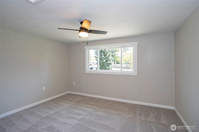 303 Alder Ln N, Pacific, WA 98047 - spare room with baseboards, a ceiling fan, and carpet