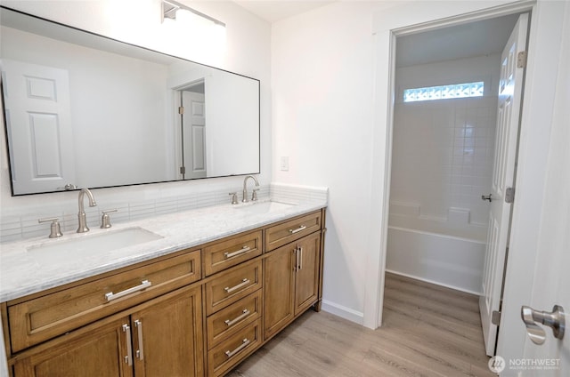 303 Alder Ln N, Pacific, WA 98047 - bathroom with double vanity, baseboards, a sink, and wood finished floors