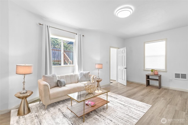 4204 Letitia Ave S, Seattle, WA 98118 - living room with baseboards, visible vents, and wood finished floors