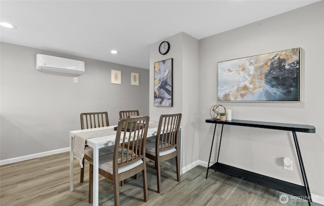 4204 Letitia Ave S, Seattle, WA 98118 - dining room with recessed lighting, wood finished floors, baseboards, and an AC wall unit