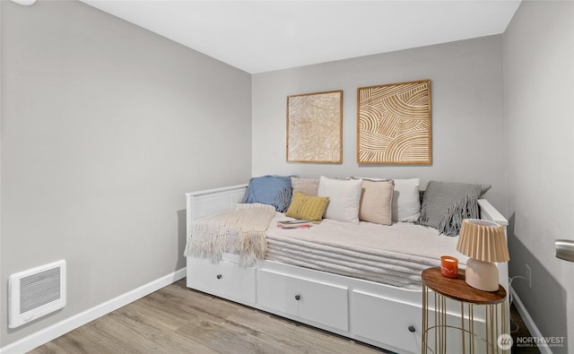 4204 Letitia Ave S, Seattle, WA 98118 - bedroom featuring baseboards, visible vents, and wood finished floors