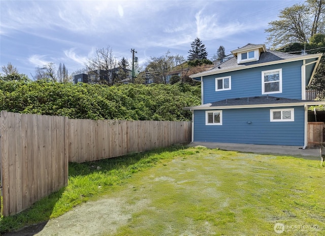 4204 Letitia Ave S, Seattle, WA 98118 - exterior space featuring a lawn, roof with shingles, and a fenced backyard