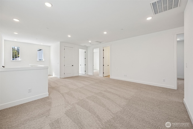 9705 205th St E Unit 29, Graham, WA 98338 - empty room with visible vents, baseboards, and light colored carpet