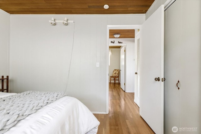 2963 Saratoga Rd, Langley, WA 98260 - bedroom with wood ceiling, baseboards, light wood-style floors, and a closet