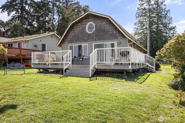 2963 Saratoga Rd, Langley, WA 98260 - rear view of house with a wooden deck, a yard, and a gambrel roof