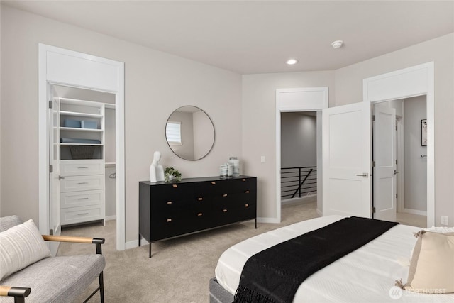 13362 NE 143rd Ct Unit 53, Woodinville, WA 98072 - bedroom with recessed lighting, baseboards, a spacious closet, and light colored carpet