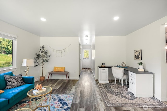 office with recessed lighting, a wealth of natural light, wood finished floors, and baseboards